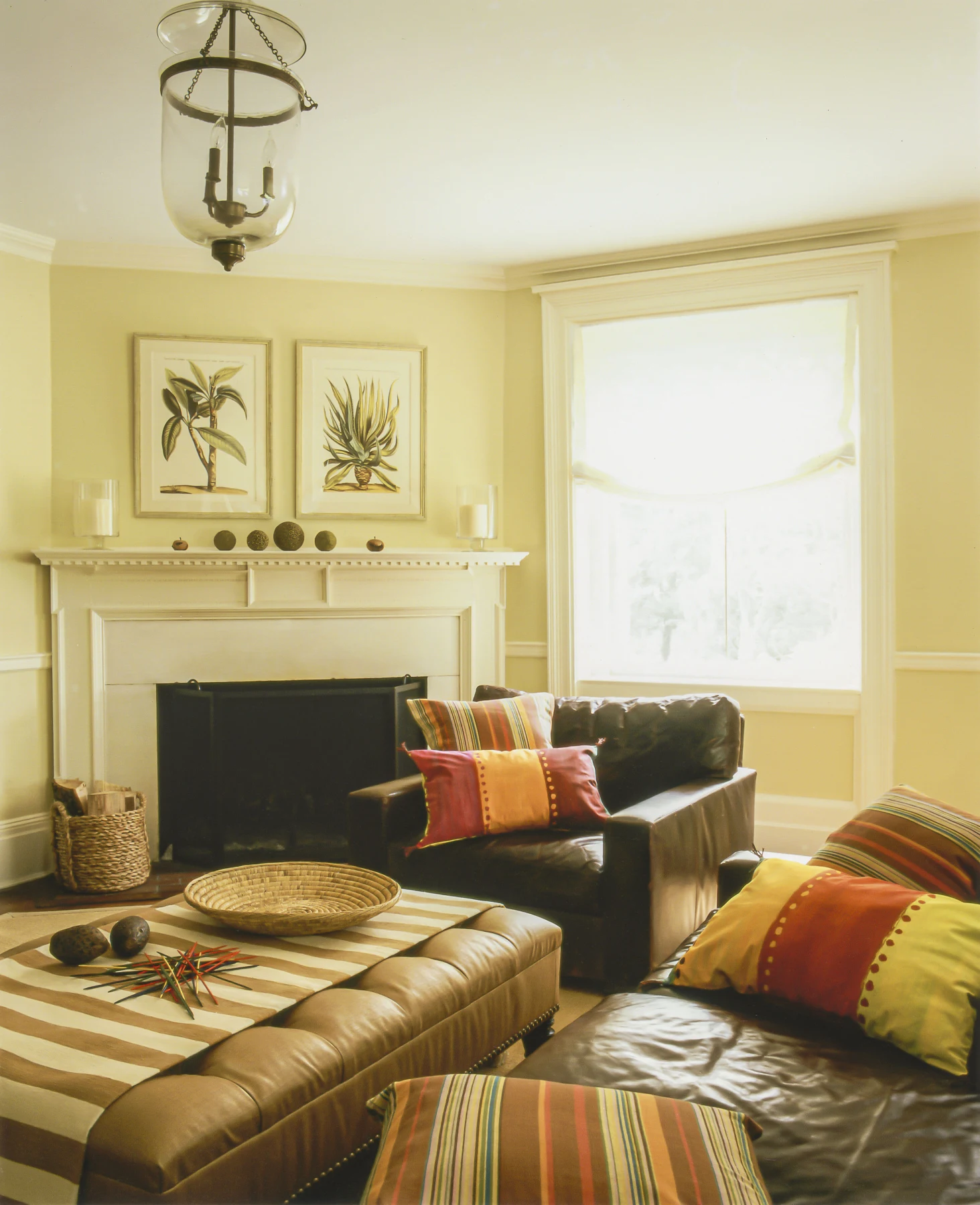 Detail of sage upholstery and collected ceramics in a New York country residence