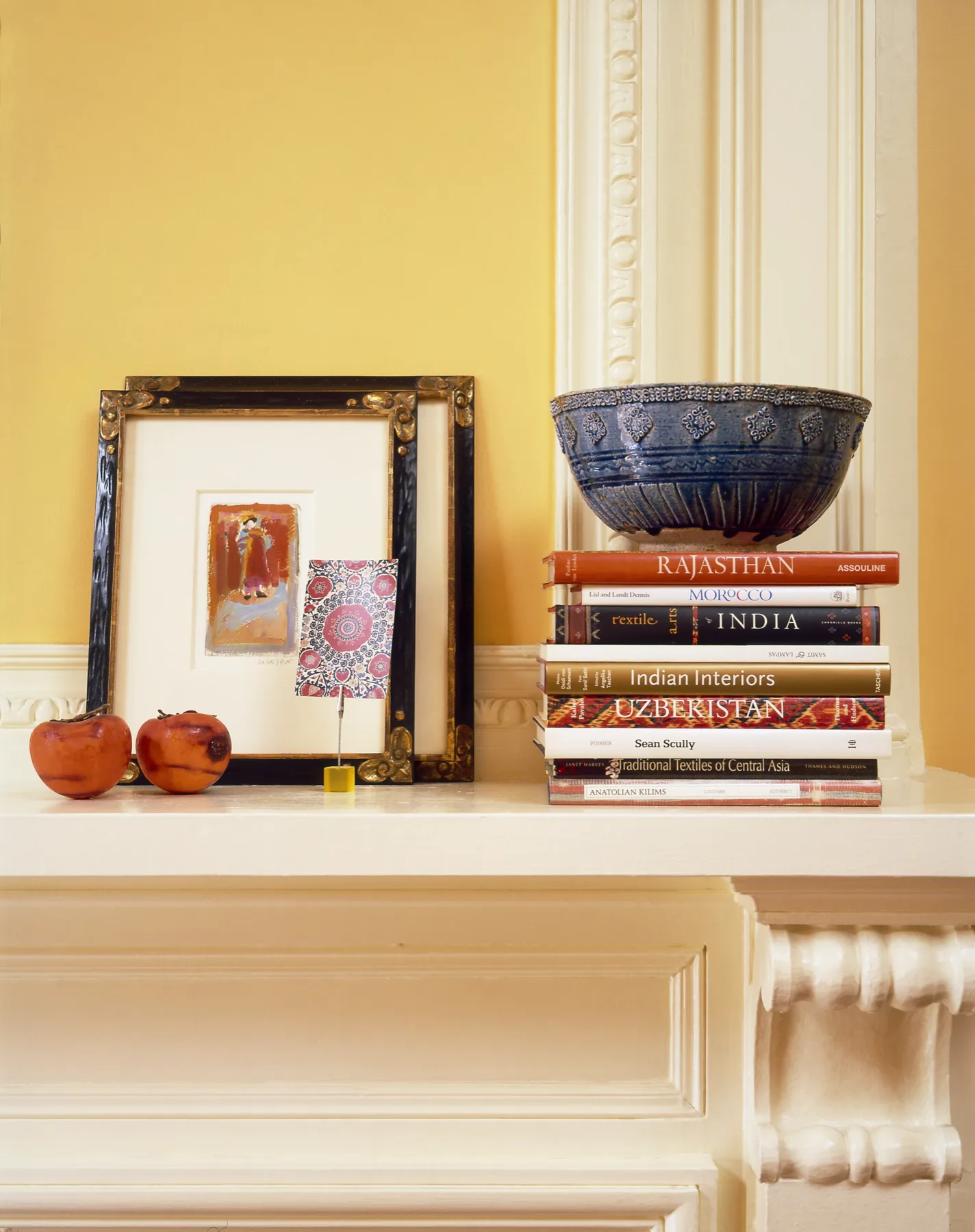 Richly layered sitting room with eastern-influenced textiles and warm patinated metals