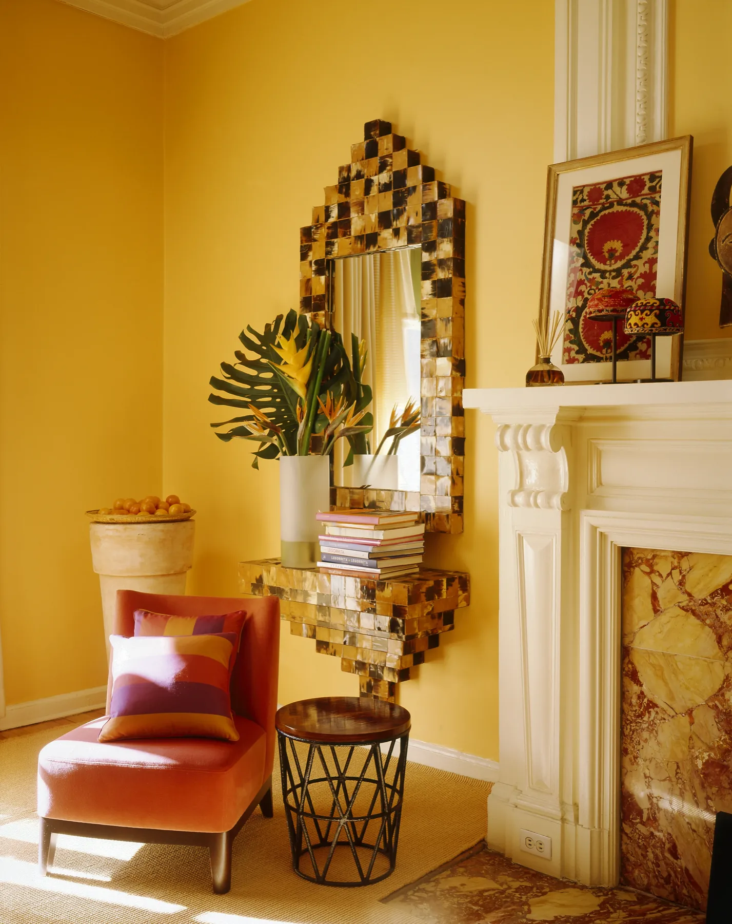 Silk-road-inspired living room with layered amber textiles and antique vessels, Upper East Side New York