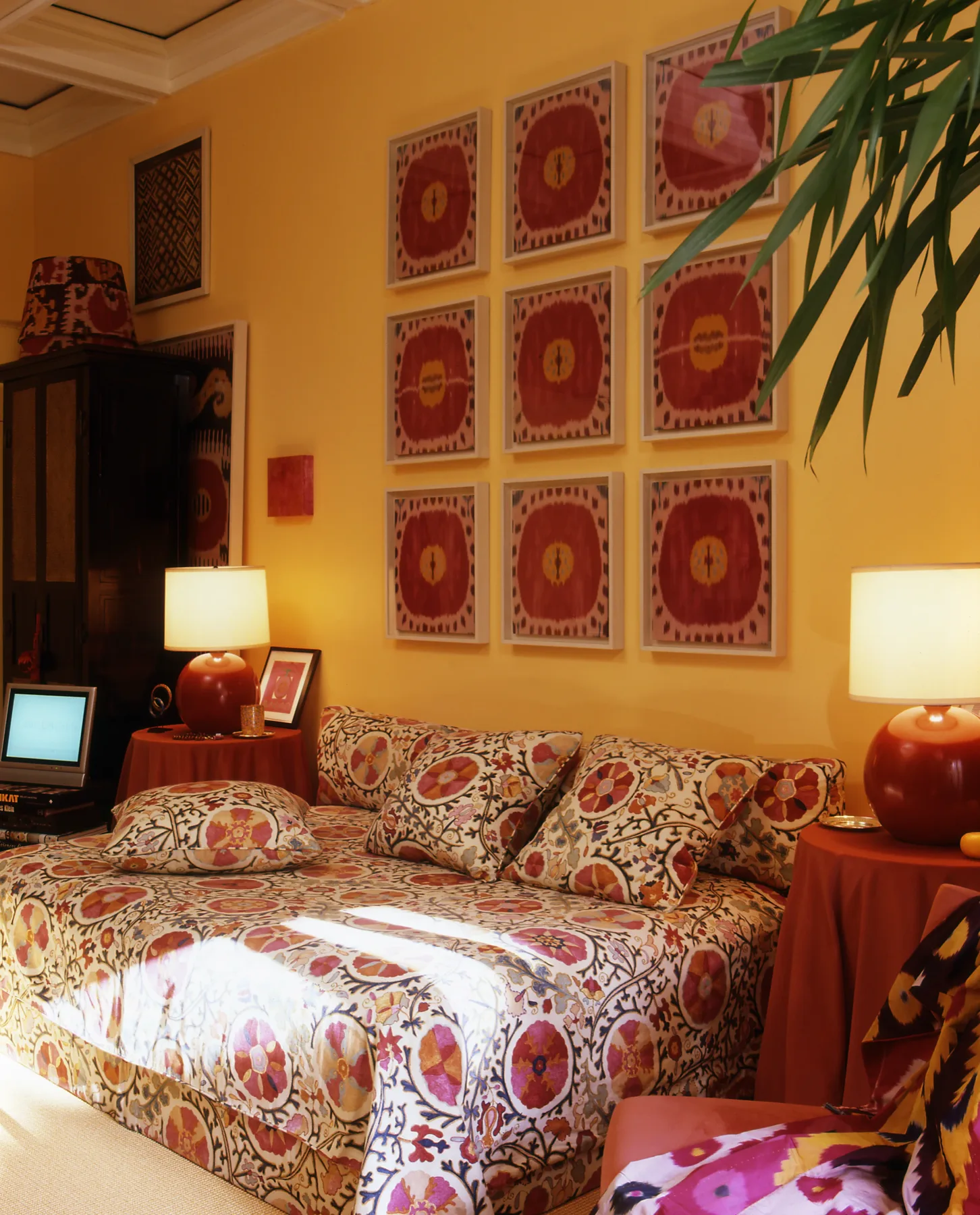 Light-filled bedroom with silk-road textiles and deep amber accents, Upper East Side