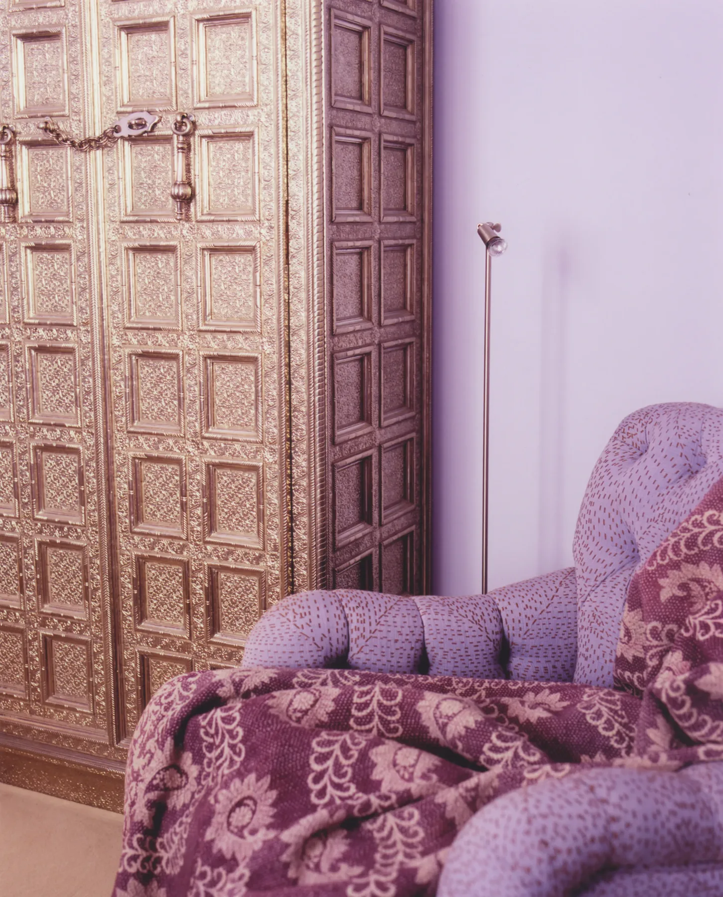 Bedroom with lush botanical palette and layered vintage textiles, Paris
