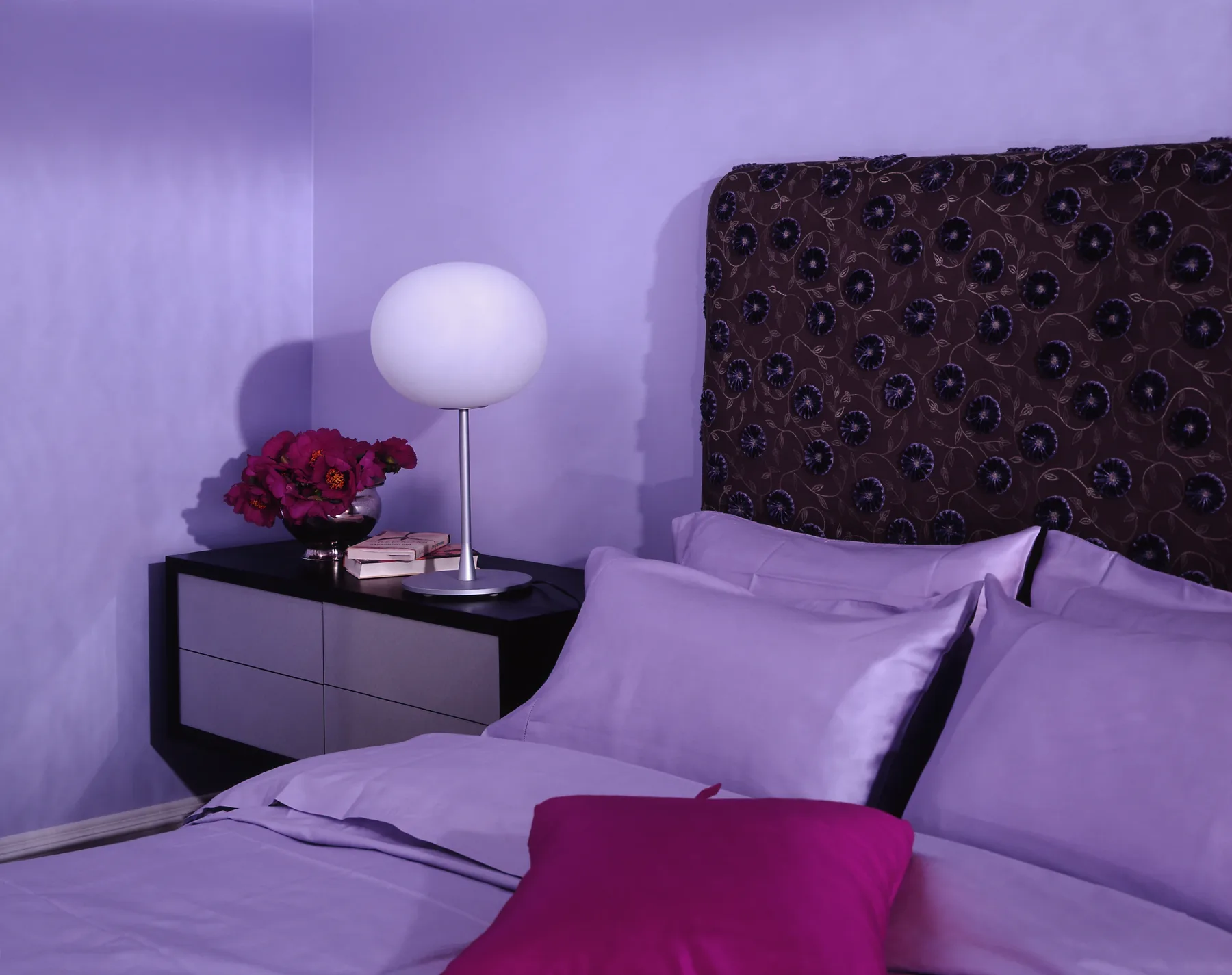 Bedroom with deep violet tones and curated vintage objects, Manhattan
