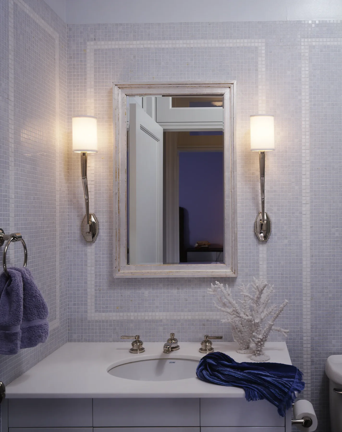 Drawing room with saturated violet palette and antique decorative pieces