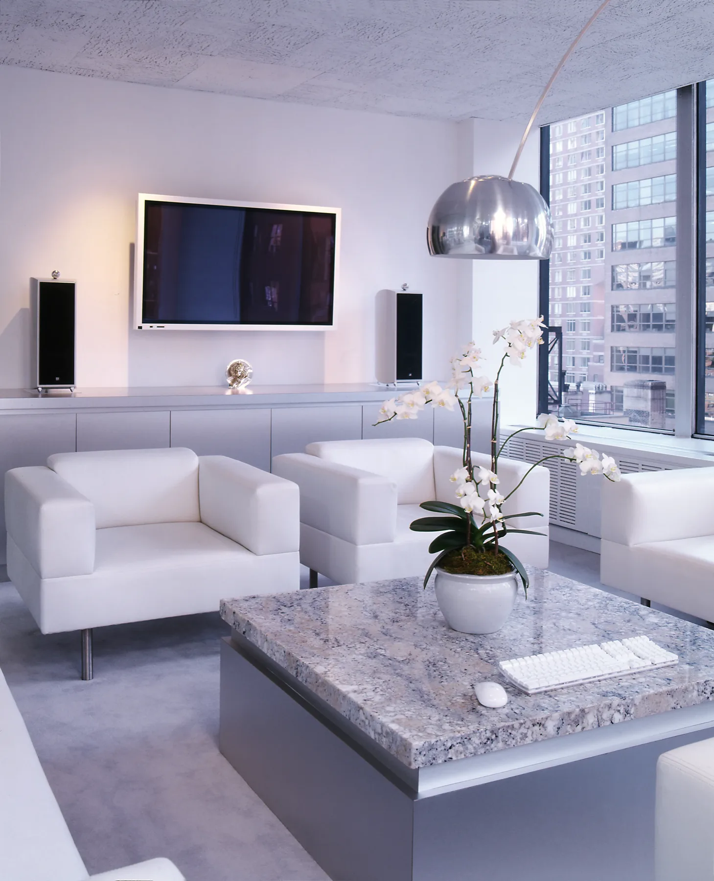 Office interior with restrained palette and rich orange upholstery, Grey Global New York