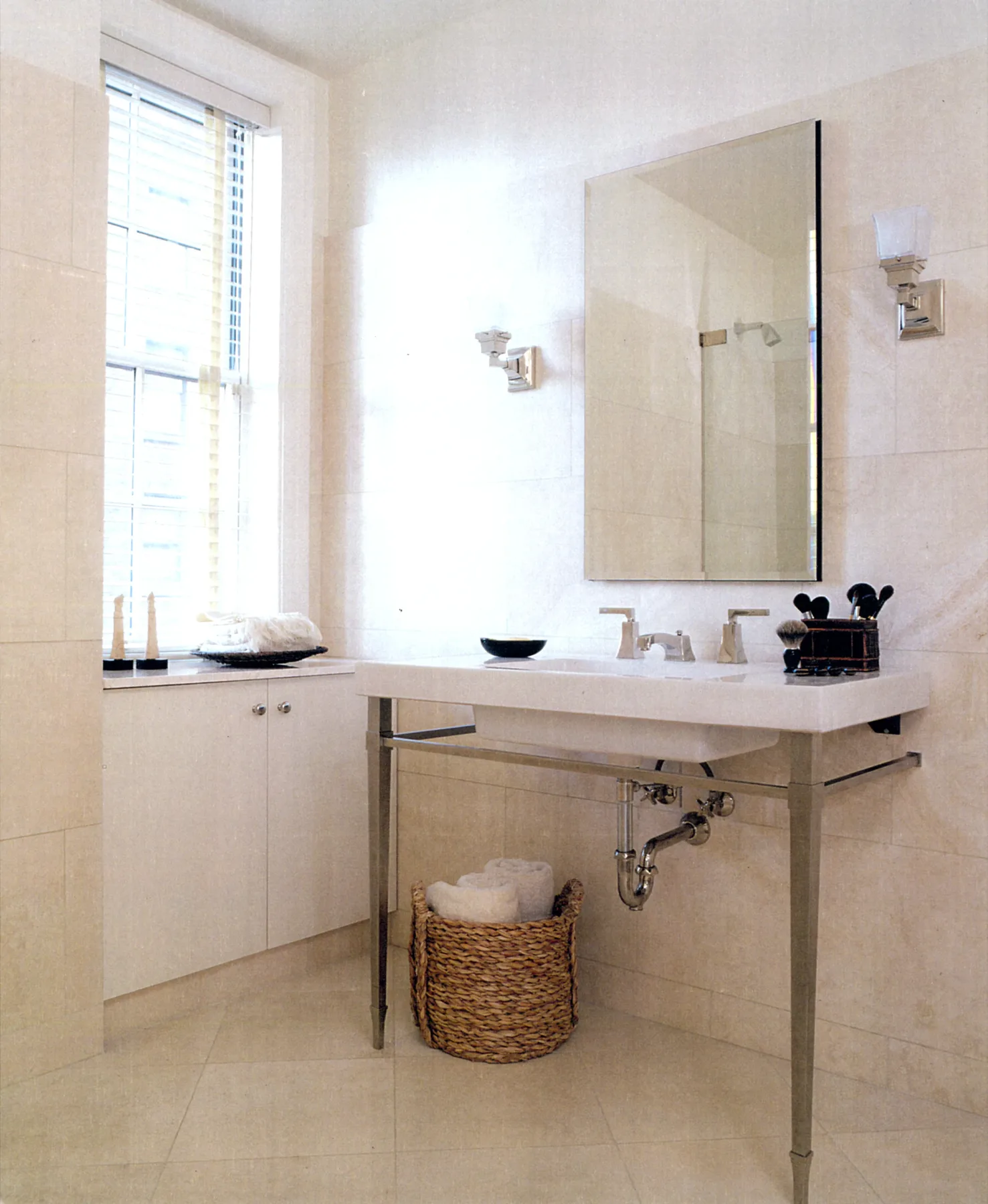 Bathroom with stone walls and warm bronze fixtures in a Manhattan residence