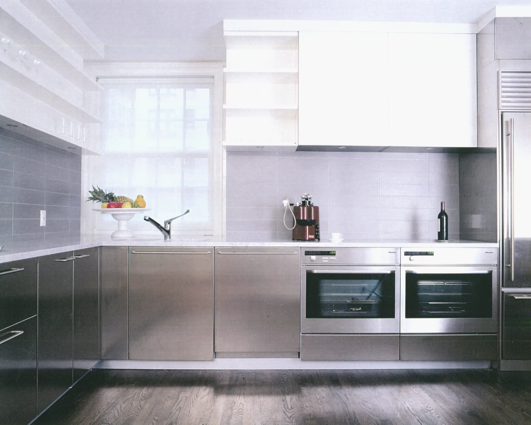 Stone kitchen with European patina and jewel-toned accessories